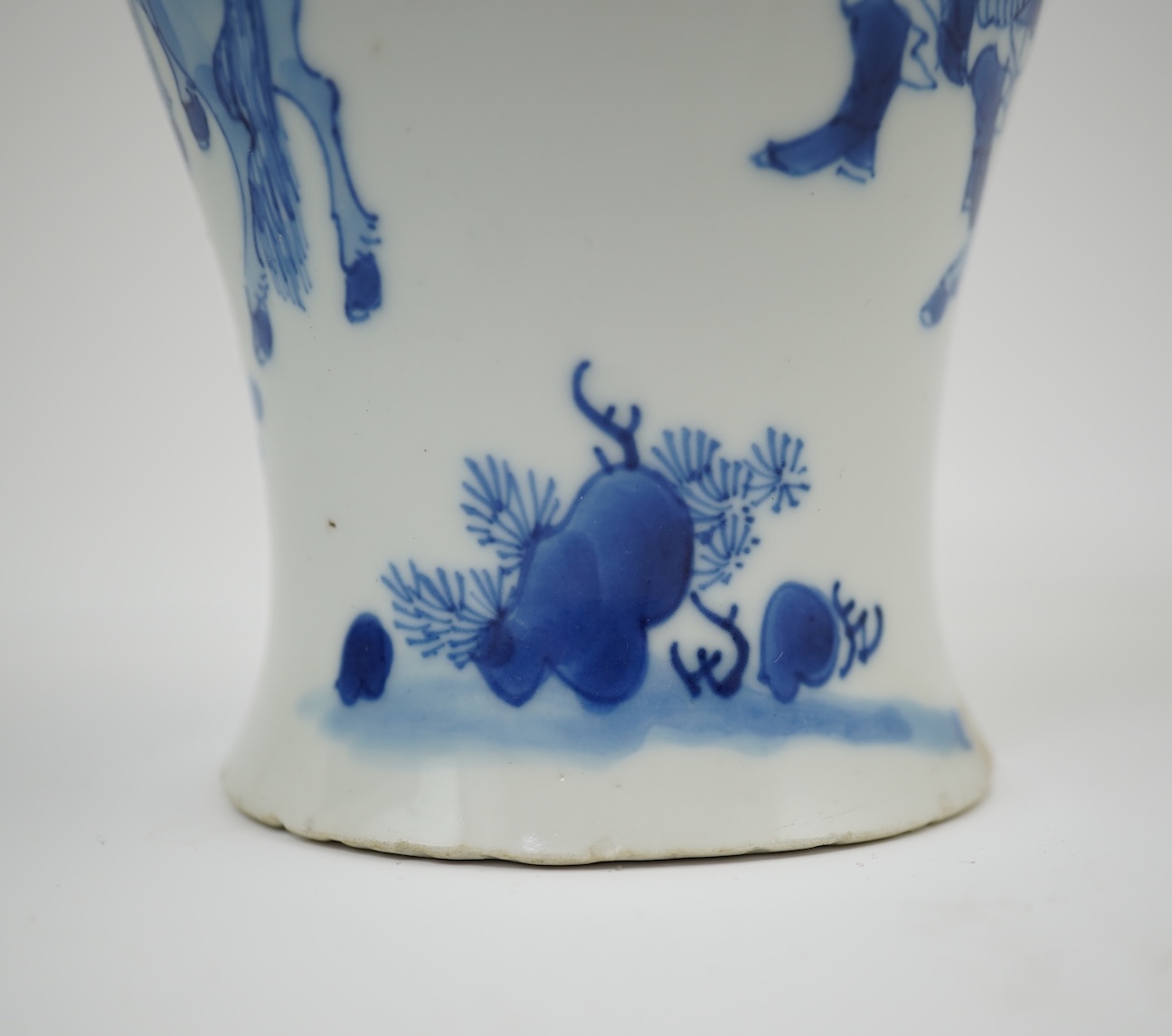 A Chinese blue and white baluster vase, early Kangxi, and associated cover